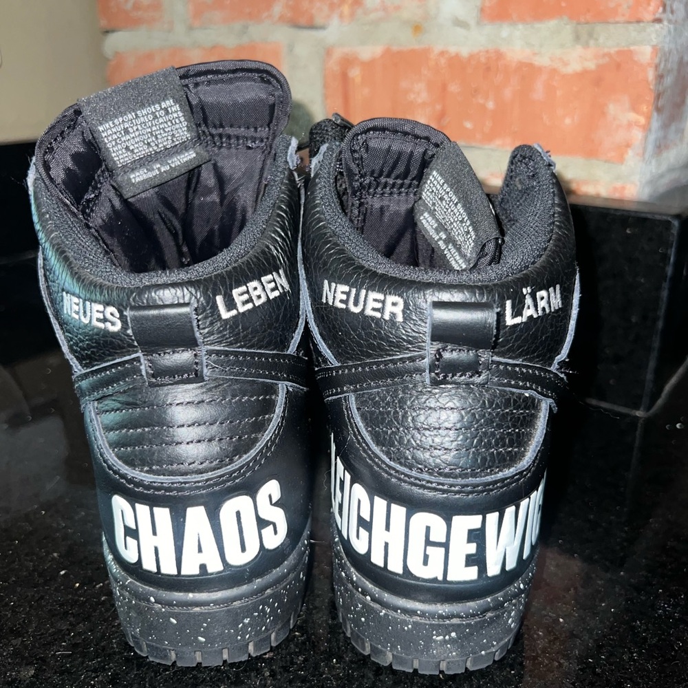 Black High-Top Sneakers with White Text
